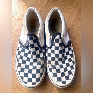 Black and white checkered vans slip ons